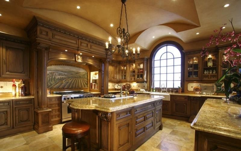 Remodeled kitchen with custom cabinetry and stone counters